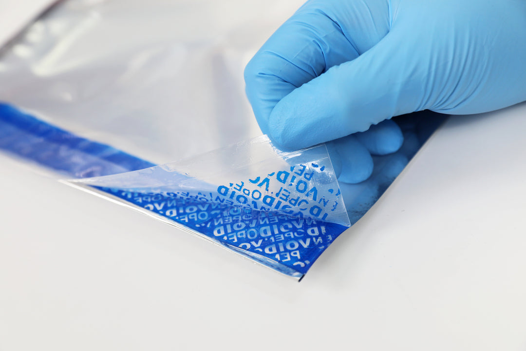 Void tamper evident label with residue